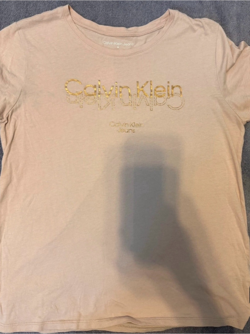 Calvin Klein Jeans Women’s Pale Pink Tee with Gold Logo